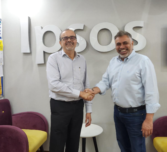 Amit Adarkar shaking hands with Sameer Grover soon after announcing acquisition of Crownit